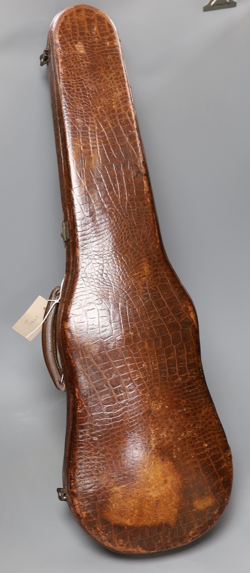 A crocodile skin violin case, formerly belonging to Jim Taylor of Lewes